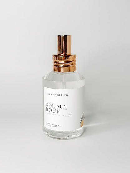 Golden Hour non-toxic, phthalate free room spray, linen spray and body mist inspired by Blue Capri Volcano. Notes of grapefruit, greenery and citrus in a clear glass bottle with a gold spray cap made by 1821 candle co in washington.