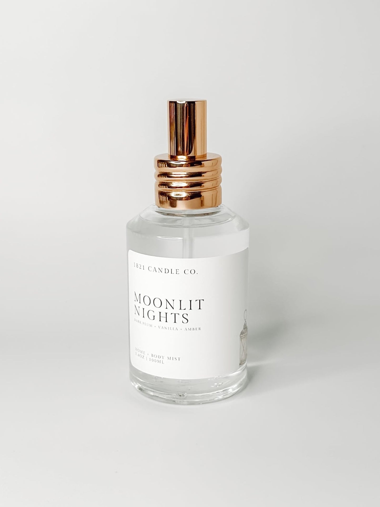 Moonlit Nights Clean Ingredient Home + Body Mist with notes of dark plum, vanilla, amber on a white background by 1821 Candle Co. Made in small batches in Washington.