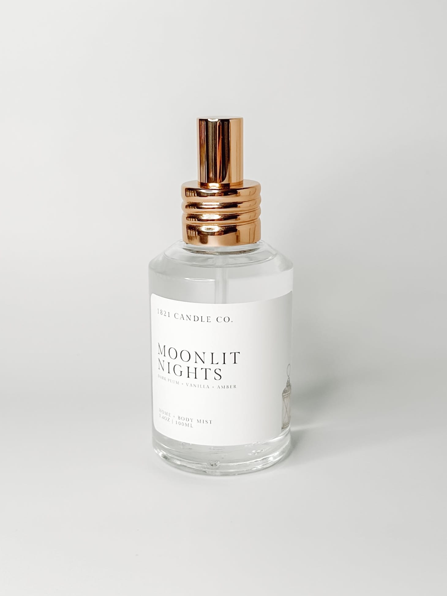 Moonlit Nights Clean Ingredient Home + Body Mist with notes of dark plum, vanilla, amber on a white background by 1821 Candle Co. Made in small batches in Washington.