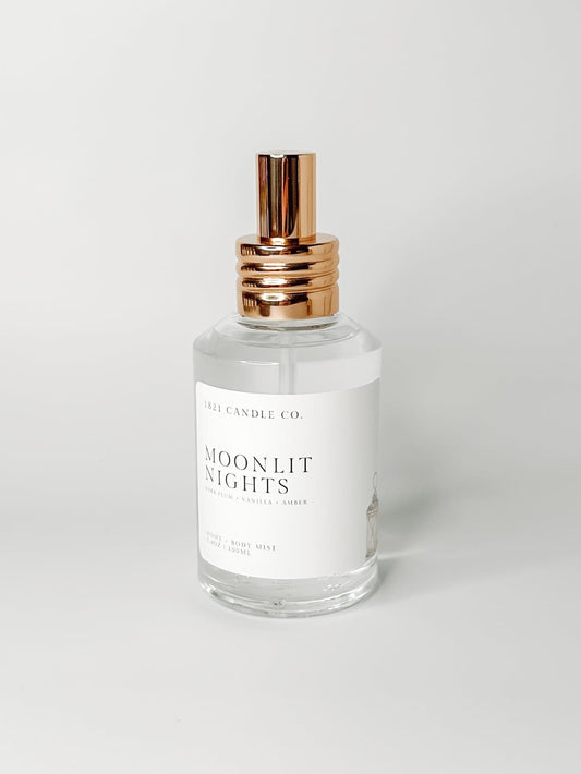 Moonlit Nights Clean Ingredient Home + Body Mist with notes of dark plum, vanilla, amber on a white background by 1821 Candle Co. Made in small batches in Washington.