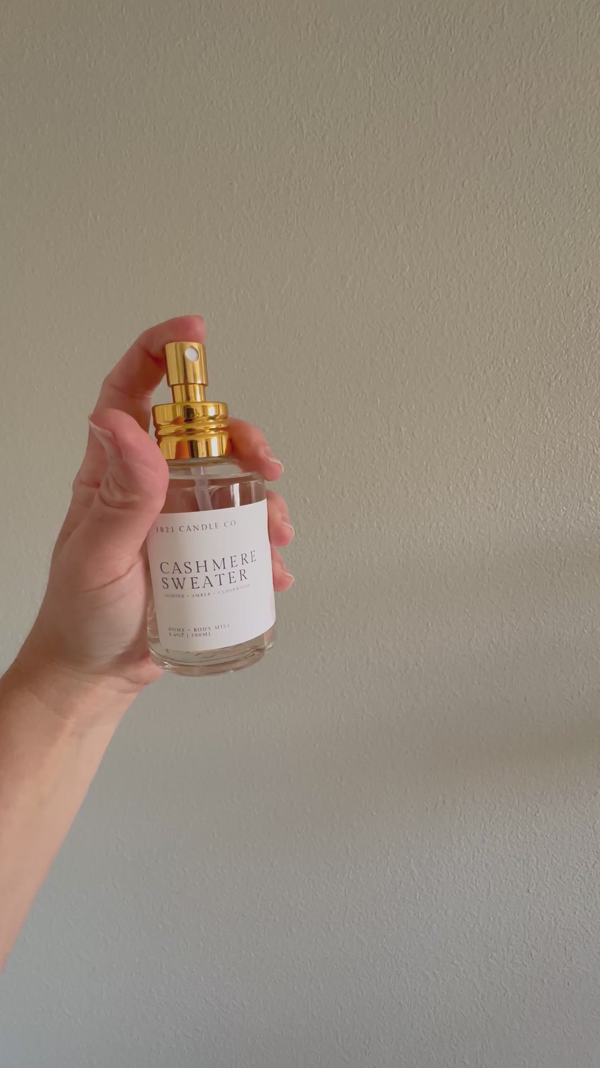 video clip of cashmeres sweater home + body mist in use showing a fine mist spray.